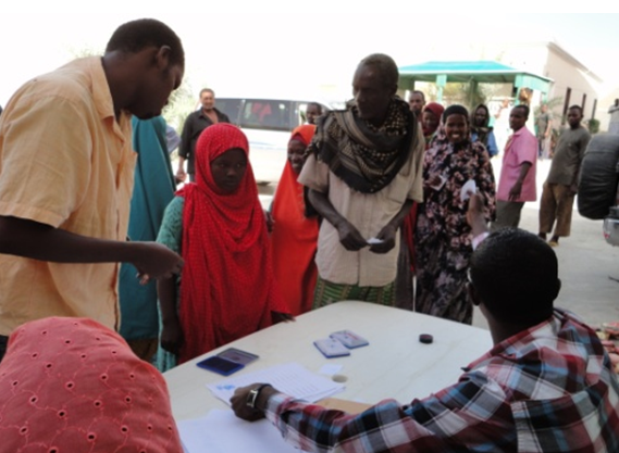 The beneficiaries are signing the list and taking NFI kits and sanitary items.